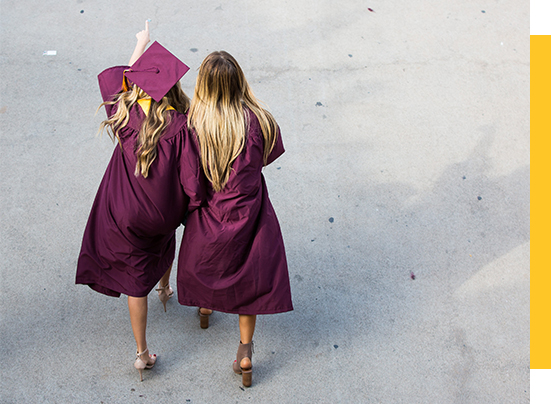Two ASU graduates walking together